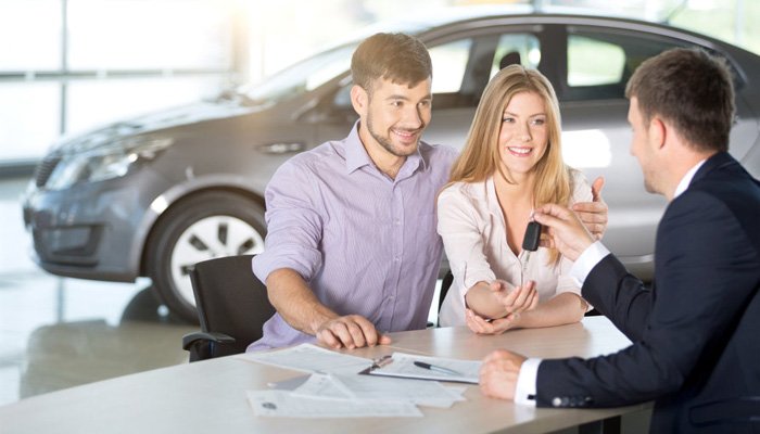 Luxury red sports car in modern showroom with bright lights and reflective floor professional automotive photography