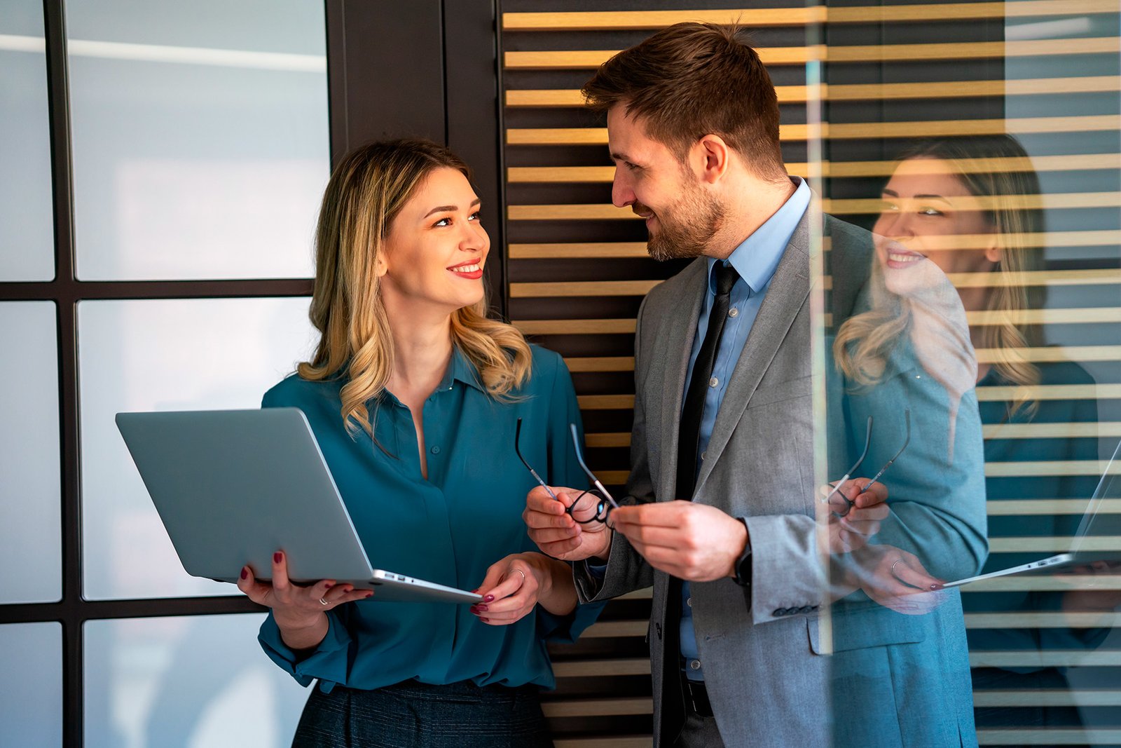Person organizing financial documents and credit cards on desk with calculator showing debt consolidation concept
